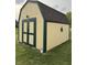 Exterior view of storage shed with siding, dark green trim, roof and a star accent on the side at 4928 Dancer Dr, Indianapolis, IN 46237
