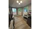 Bright dining area featuring hardwood floors and a view of the lush yard at 5010 Melbourne Rd, Indianapolis, IN 46228