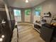 Bright dining area with modern light fixture, and a view of the lush yard at 5010 Melbourne Rd, Indianapolis, IN 46228