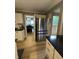 View of a kitchen with stainless steel refrigerator and light wood floors at 5010 Melbourne Rd, Indianapolis, IN 46228
