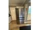 Kitchen with stainless steel refrigerator and light wood floors at 5010 Melbourne Rd, Indianapolis, IN 46228