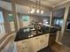 Bright kitchen with modern lighting and stainless steel dishwasher at 5010 Melbourne Rd, Indianapolis, IN 46228