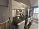 Spacious kitchen featuring a black island countertop, stainless steel appliances, and modern lighting at 5010 Melbourne Rd, Indianapolis, IN 46228
