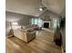 Bright living room featuring hardwood floors, a fireplace, and vaulted ceilings at 5010 Melbourne Rd, Indianapolis, IN 46228