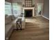 Cozy living room with a fireplace, hardwood floors, and plenty of natural light at 5010 Melbourne Rd, Indianapolis, IN 46228