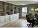 Bright home office with built-in bookshelves and modern desk setup at 5010 Melbourne Rd, Indianapolis, IN 46228