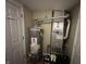 This utility room features a water heater and HVAC, offering essential home systems in an organized space at 5010 Melbourne Rd, Indianapolis, IN 46228
