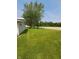 Expansive backyard with lush green lawn and mature trees, offering a serene outdoor space at 520 E County Road 500 S, Muncie, IN 47302