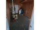 Basement featuring a water heater and other utilities in a wood-paneled room at 520 E County Road 500 S, Muncie, IN 47302