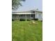Charming single-story home featuring a well-maintained lawn and awning-covered entry at 520 E County Road 500 S, Muncie, IN 47302