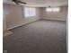 Spacious living room with neutral carpet, trim, and ample natural light at 520 E County Road 500 S, Muncie, IN 47302