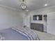 This bedroom features neutral walls, a plush comforter, and an overhead light fixture at 5755 Victory Dr, Columbus, IN 47203