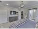 This bedroom features neutral walls, carpeted floors, an overhead light fixture, and an ensuite at 5755 Victory Dr, Columbus, IN 47203