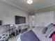 Cozy bedroom features a desk, TV, and closet space for a functional and comfortable living space at 5755 Victory Dr, Columbus, IN 47203