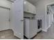 Laundry room features new washer and dryer units, offering efficient functionality within the home at 5755 Victory Dr, Columbus, IN 47203