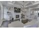 Cozy living room featuring a fireplace, large sectional sofa, hardwood floors, and decorative accents at 5755 Victory Dr, Columbus, IN 47203