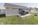 This home has a lovely outdoor patio with furniture, perfect for entertaining and enjoying the outdoors at 5755 Victory Dr, Columbus, IN 47203