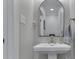 Chic powder room features a pedestal sink with modern faucet and ample space at 5755 Victory Dr, Columbus, IN 47203