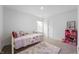 Charming bedroom with a window, plush rug, stuffed animals and pink shelving at 5794 Wintersweet Ln, Whitestown, IN 46075