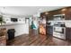 Modern kitchen with stainless steel appliances, and open view to the Gathering room at 5794 Wintersweet Ln, Whitestown, IN 46075