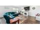 Bright living room with dark wood flooring, stylish furniture, and a modern fireplace at 5794 Wintersweet Ln, Whitestown, IN 46075