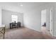 Bright and airy office space with lots of natural light, modern table, and two chairs at 5794 Wintersweet Ln, Whitestown, IN 46075