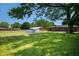 Large backyard with a lush lawn and an above-ground pool at 614 Belzer Dr, Anderson, IN 46011