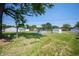 Spacious backyard featuring a well-maintained lawn, above-ground pool, and shed at 614 Belzer Dr, Anderson, IN 46011