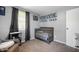 Cozy Bedroom featuring a gray crib, carpeting and decor, and window with natural light at 614 Belzer Dr, Anderson, IN 46011