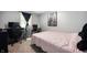 A bedroom featuring desk and a chair in neutral tones, with carpeted floor at 614 Belzer Dr, Anderson, IN 46011