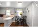Bright eat-in kitchen featuring light-colored cabinetry and matching countertops at 614 Belzer Dr, Anderson, IN 46011