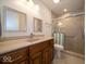 Bathroom features a single vanity, toilet, and shower with tile surround at 6408 Old Mill Dr, Indianapolis, IN 46221