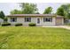 Charming ranch-style home featuring a well-maintained lawn, blue shutters, and an attached one car garage at 6408 Old Mill Dr, Indianapolis, IN 46221