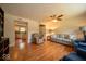 Comfortable living room featuring hardwood floors and a view of the adjacent kitchen at 6408 Old Mill Dr, Indianapolis, IN 46221