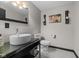 Modern powder room with vessel sink, contemporary fixtures, and minimalist decor at 6524 Turning Leaf Ln, Indianapolis, IN 46236