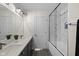 Modern bathroom features double sinks, marble tile shower, and neutral color palette at 6524 Turning Leaf Ln, Indianapolis, IN 46236