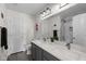 Well-lit bathroom featuring double vanity with quartz countertops, and great natural light at 6524 Turning Leaf Ln, Indianapolis, IN 46236