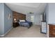 Spacious bedroom with accent wall, ceiling fan, and carpeted floors at 6524 Turning Leaf Ln, Indianapolis, IN 46236