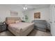 Bedroom featuring large bed, neutral colors, and great natural light at 6524 Turning Leaf Ln, Indianapolis, IN 46236