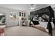 Bedroom featuring four poster bed, vanity desk and great natural light at 6524 Turning Leaf Ln, Indianapolis, IN 46236