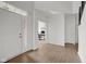 Bright foyer with hardwood floors, white walls, front door, and entry to office at 6524 Turning Leaf Ln, Indianapolis, IN 46236