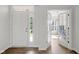 Bright foyer with hardwood floors, white walls, front door and french door entry at 6524 Turning Leaf Ln, Indianapolis, IN 46236