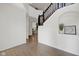 Bright foyer with hardwood floors, white walls, staircase and decorative niche at 6524 Turning Leaf Ln, Indianapolis, IN 46236