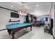 Brightly lit game room with billiards table and wet bar, designed for recreation at 6524 Turning Leaf Ln, Indianapolis, IN 46236