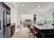 Open-concept kitchen with stainless appliances offers easy access to dining and living areas at 6524 Turning Leaf Ln, Indianapolis, IN 46236
