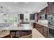 Bright kitchen featuring granite counters, stainless steel appliances, and access to the outdoor patio at 6524 Turning Leaf Ln, Indianapolis, IN 46236