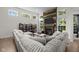 Bright living room featuring a modern fireplace and large windows bringing in natural light at 6524 Turning Leaf Ln, Indianapolis, IN 46236