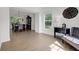 Bright living room showcases wood-look floors and leads to dining area with natural light at 6524 Turning Leaf Ln, Indianapolis, IN 46236