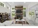 Bright living room featuring a modern fireplace and large windows bringing in natural light at 6524 Turning Leaf Ln, Indianapolis, IN 46236