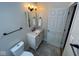 Updated half bathroom featuring modern vanity, updated fixtures and a decorative mirror at , Indianapolis, IN 46227
